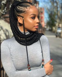 Accessorized Cornrows Plaited To Form A Bun among the top beach hairstyles